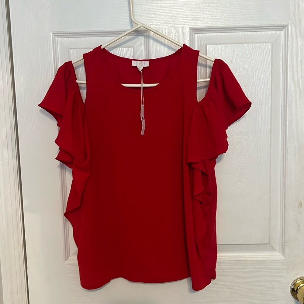 Red blouse with a shoulder strap and off shoulder sleeves